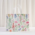 Waterproof non-woven gift bag featuring vibrant floral patterns and white webbed handles - Pink Wildflower Style (8011-3)