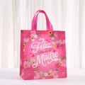 Detail of pink floral non-woven gift bag with Spanish Feliz Dia de la Madre text - 29x27x12 / Pink Purple Full Floral Style (5066-5)