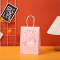 Close-up of pink unicorn gift bag with rainbow pattern and white rope handles - Pink Gradient Unicorn (404-1)