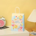 Pastel birthday kraft paper gift bag with balloons and white rope handles in home setting - Blue Yellow Splicing Style(606-1) / H21*L15*W8CM