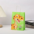 Close-up of green kraft paper gift bag with yellow cartoon dinosaur for party favors - 21x15x5 / Green