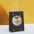 Elegant black gift paper bag with gold glitter pattern and white rope handles - Starry Wishes (1)
