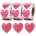 Detail of pink holographic heart stickers on rolls and loose for DIY crafts - Laser Purple Pink (BB-2)