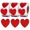 Macro view of red glitter heart-shaped stickers on rolls for Valentine gift wrapping - Laser Fine Sand Red (BB-3)