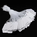 Stack of white jewelry price tags with strings on a black reflective background - Blank Space 2.3*1.3cm