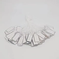 Macro detail of jewelry price tags with silver borders and white hanging strings - Silver-edged Lettering 2.6*1.2cm