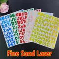 Macro detail of laser alphanumeric stickers with fine glitter texture in five colors - Fine Sand Laser / Silver