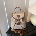 Vintage suede backpack with brown leather trim and marble texture shown in a retro scene - Gray