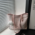 Pink quilted tote bag with butterfly embroidery and plush charm near a sunny window - With Pendant / Pink