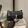 Minimalist black lychee texture leather underarm bag with an oval gold metal buckle - Black