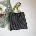 Black and white striped canvas tote bag featuring vibrant green contrast shoulder straps - Black and White Stripes with Green Handle / Black