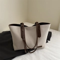 Minimalist canvas tote bag with brown leather handles and decorative fashion label - White & Coffee