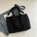 Schwarze Cord-Einkaufstasche mit verstellbarem Riemen und strukturierter Oberfläche - Schwarz