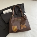 Dark brown tote bag with embroidery detail and shield patch in soft matte finish - Brown