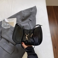 Glossy black hobo shoulder bag with a gold piston lock buckle and adjustable strap - Black