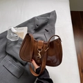 Deep brown patent leather underarm bag with gold metallic buckle in minimalist style - Brown