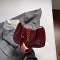 Fashionable dark red crescent shoulder bag with golden buckle and glossy finish - Burgundy