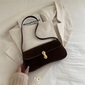 Elegant dark brown suede baguette bag with gold buckle on a white blazer background - Coffee without Pendant