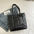Large black quilted down tote bag in a casual style for winter travel and commuting - Black