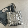 Stylish silver quilted tote bag with metallic finish and large front pocket detail - Silver