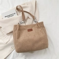 Light brown corduroy tote bag with leather handles and fashion label in autumn style - Khaki