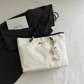 White large capacity tote bag with black handles and cute plush charm for daily commute - White With Pendant