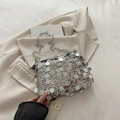 Elegant silver sequin crossbody bag with chain strap on aesthetic minimalist background - Silver