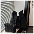 Detail of leopard print tote bag set featuring large shoulder bag and small zipper pouch - Black Leopard