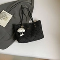 Black quilted tote bag with a minimalist diamond pattern and a white cloud charm - Black With Pendant