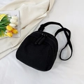 Fashionable black corduroy shell-shaped crossbody bag with soft textured finish and strap - Black