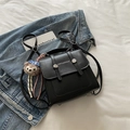 Retro black matte leather backpack with white lettering and cute bear charm accessory - Black With Pendant