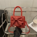 Sac de soirée rouge scintillant avec grand nœud et poignée pour femmes lors de fêtes - Rouge