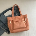Chic salmon pink canvas tote bag featuring front flap pocket and decorative side zippers - Orange