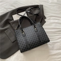Bolso tote negro y gris con monograma, asas dobles y detalles metálicos dorados - Negro