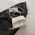 Chic white structured handbag with golden double-ring buckle and crossbody strap - White