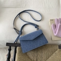 Blue leopard embossed shoulder bag with knot handle and adjustable strap in a stylish setup - Blue