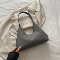 Gray leopard print crescent shoulder bag with silver hardware on beige blazer - Gray