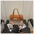 Detail of color-block flap bag featuring brown leather, canvas and gold metal lock - Brown
