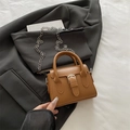 Retro brown mini handbag featuring a vintage buckle and sleek silver chain strap - Tan