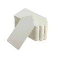 Close-up of white wavy edge kraft paper tags with pre-punched holes in stack - 100 White Sheets/set