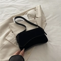 Minimalist black underarm bag with asymmetrical suede flap and metal buckle detail - Black