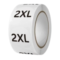 Macro shot of 2XL round clothing size stickers on a roll for apparel retail - Size 2XL / Diameter 2.5cm