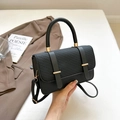 Fashionable black faux leather messenger bag with textured flap and gold hardware - Black