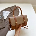 Chic two-tone woven leather messenger bag with gold hardware and top handle - Brown