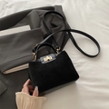 Retro black leather handbag with gold twist lock and stylish suede stitching detail - Black