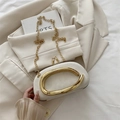 Beige round evening clutch bag with golden C-handle and fine metal chain strap - White