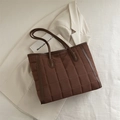 Deep brown quilted tote bag with glossy nylon finish and leather-textured dual handles - Brown