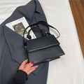 Minimalist black faux leather crossbody bag with knot handle and rectangular foldover flap - Black