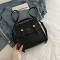 British retro black backpack in woven PU leather with top handle and gold button - Black