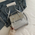 Silver metallic retro backpack with textured stitching and gold decorative buckles - Silver